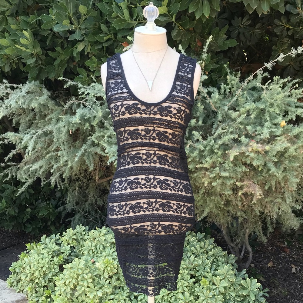 Emma & Sam form fitting overlay dress.